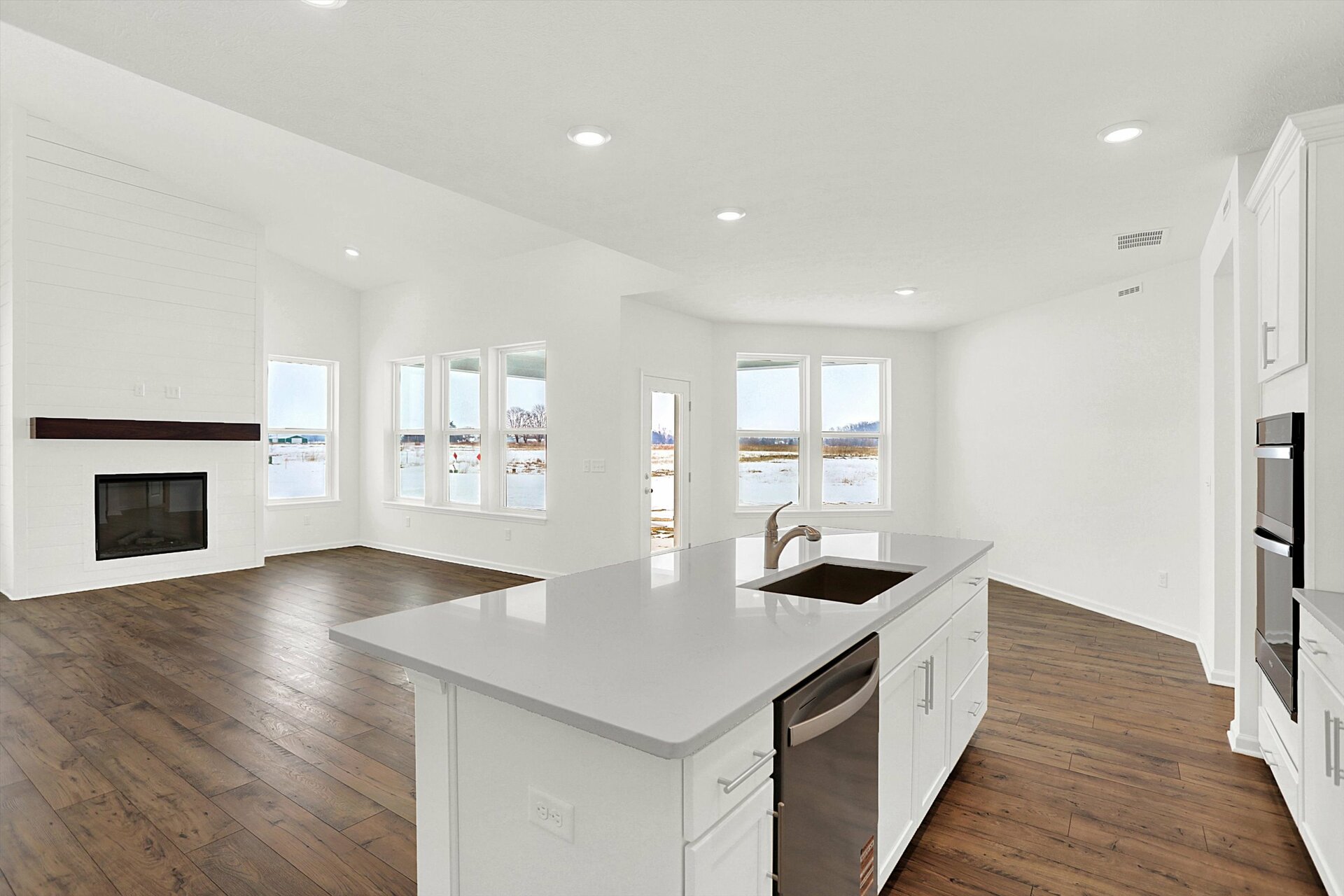 open-concept kitchen with large island looking into the great room
