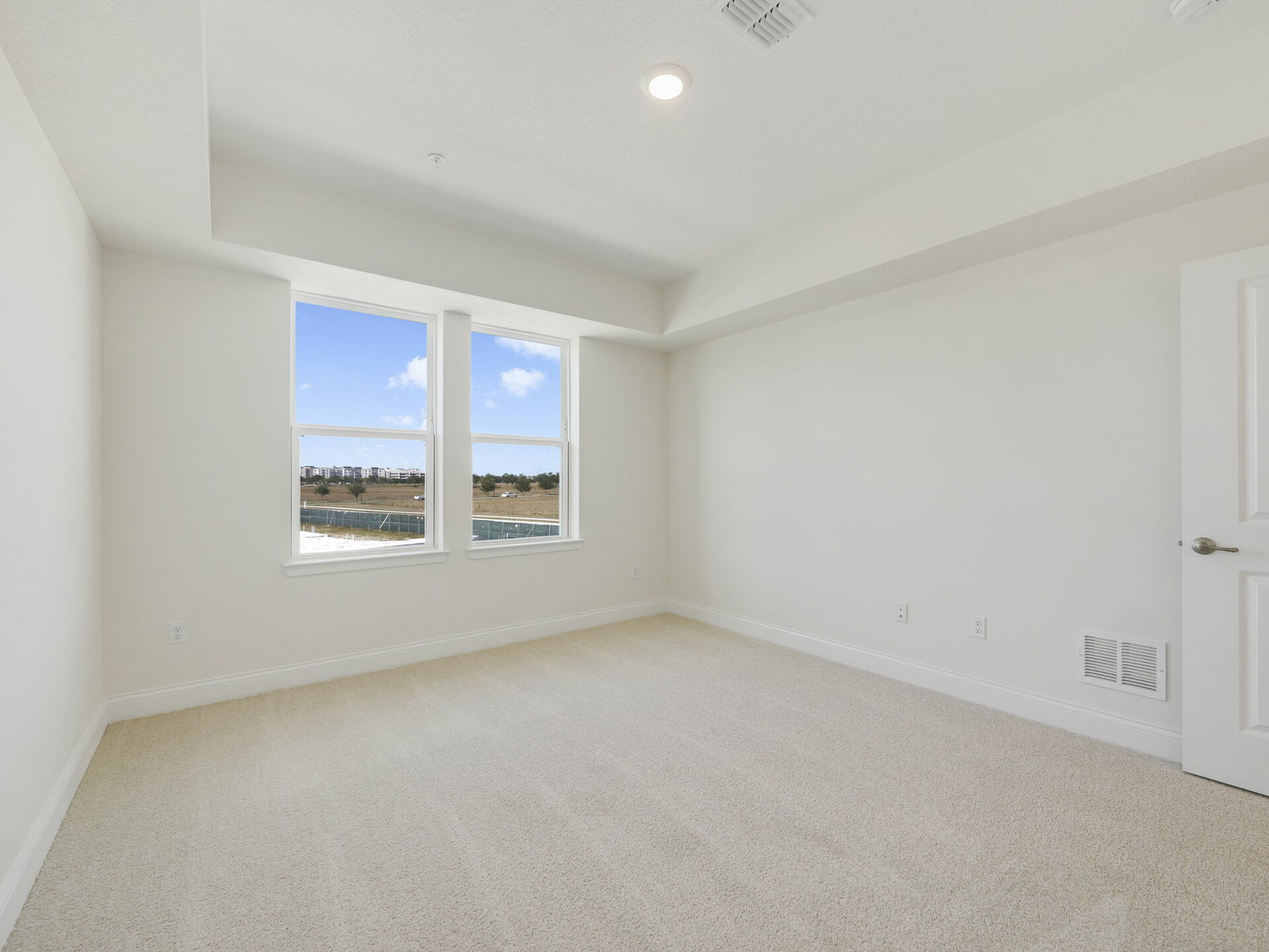 tray ceiling with carpet throughout