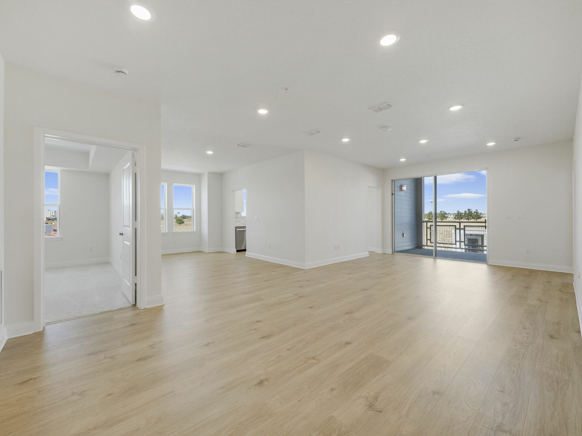 living room with view of flex space