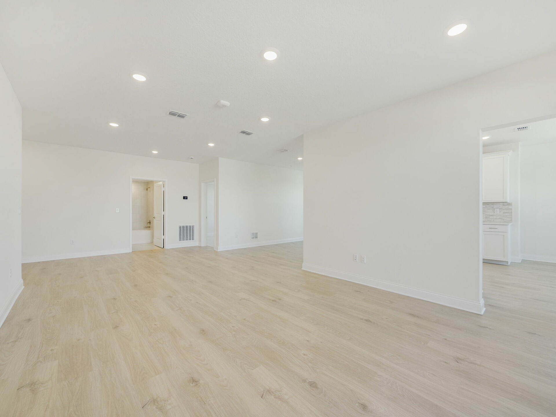 living room with view of flex space