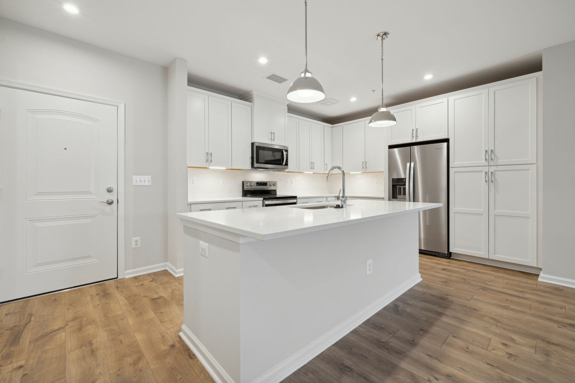kitchen with white cabinets and countertops