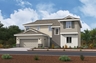 exterior of two-story home with neutral paint and desert landscaping