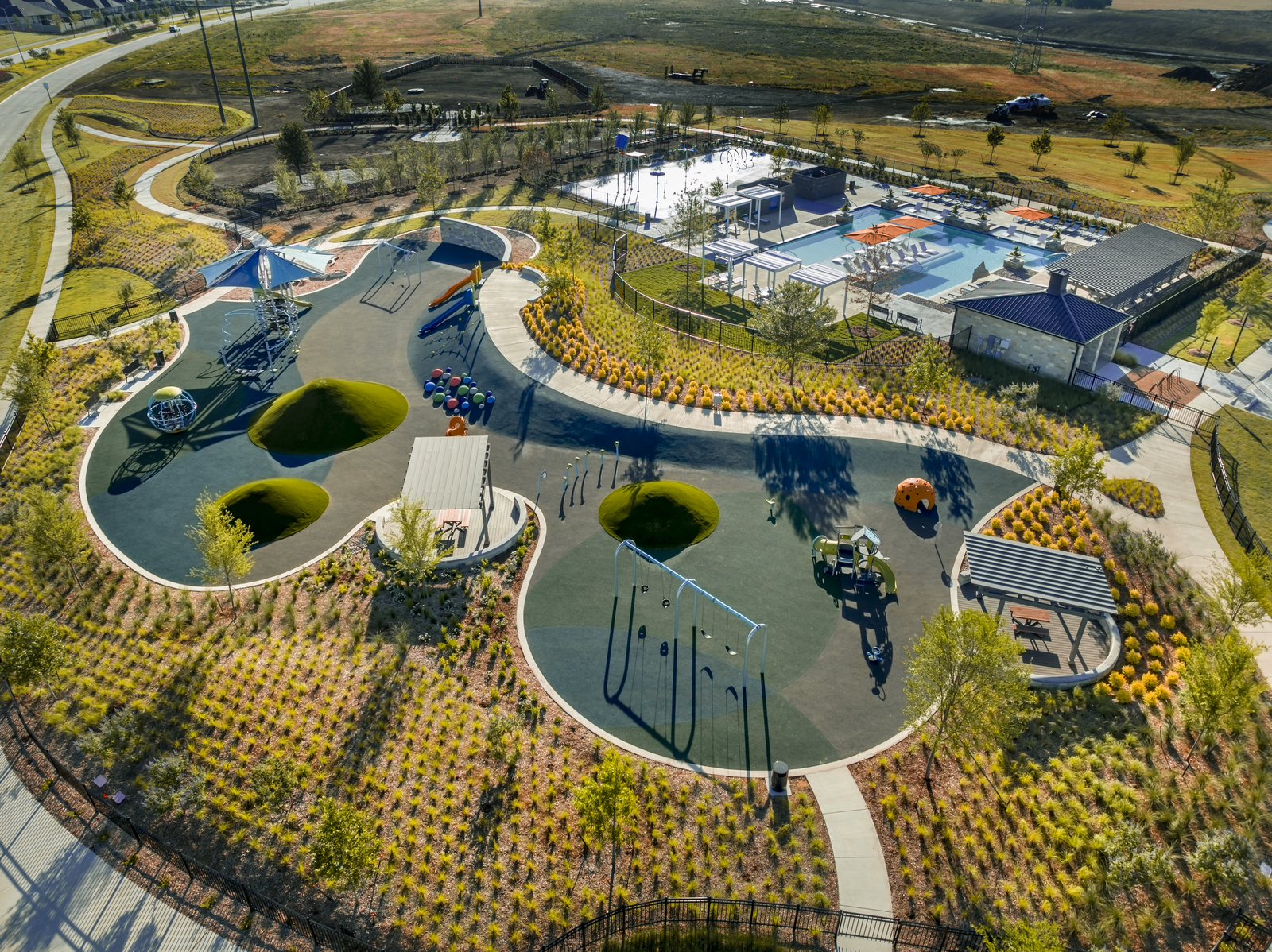 community pool, splashpad, playground and dog park