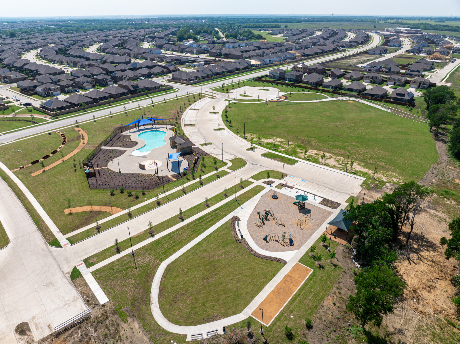 community pool next to a large playground