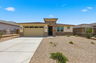 single-story single-family home with desert landscaping and a concrete driveway