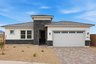 single-story with desert landscaping and paver driveway