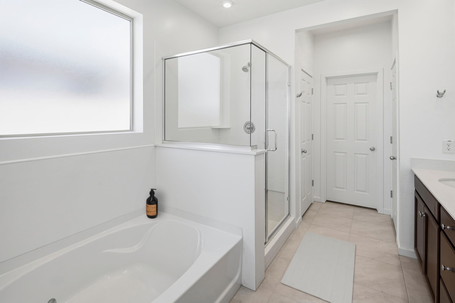 spacious bathroom with a walk-in shower and a soaking tub