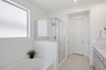 spacious bathroom with a walk-in shower and soaking tub
