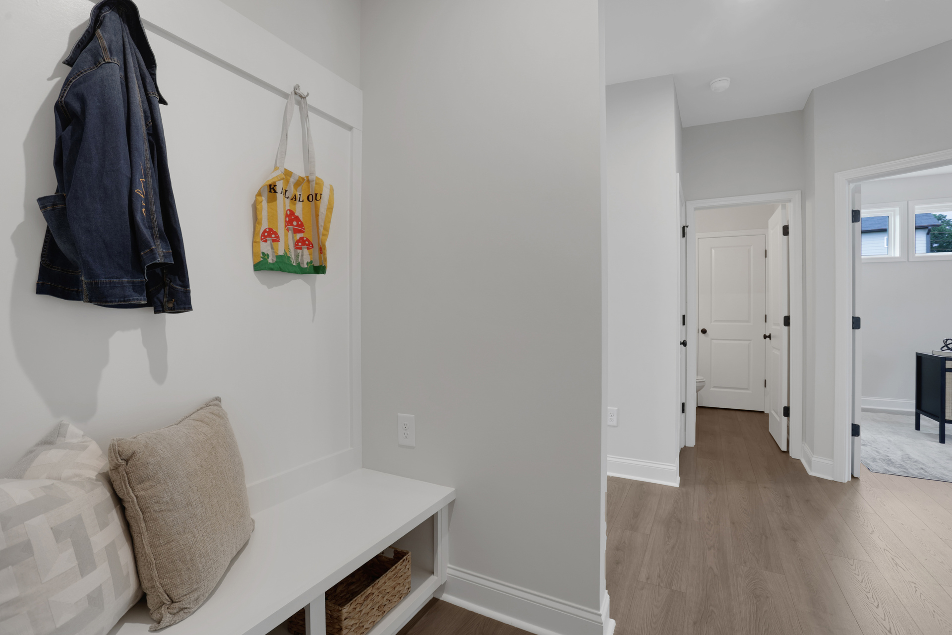 mud room with hard surface flooring and valet