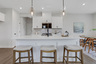 kitchen with white cabinets and quartz counters