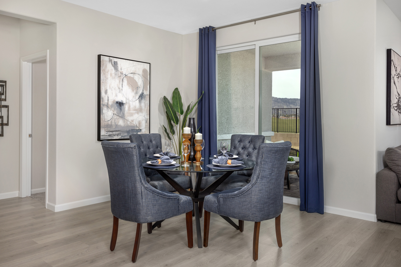 dining room with circular table and blue chairs