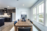 dining room with hard surface flooring and windows