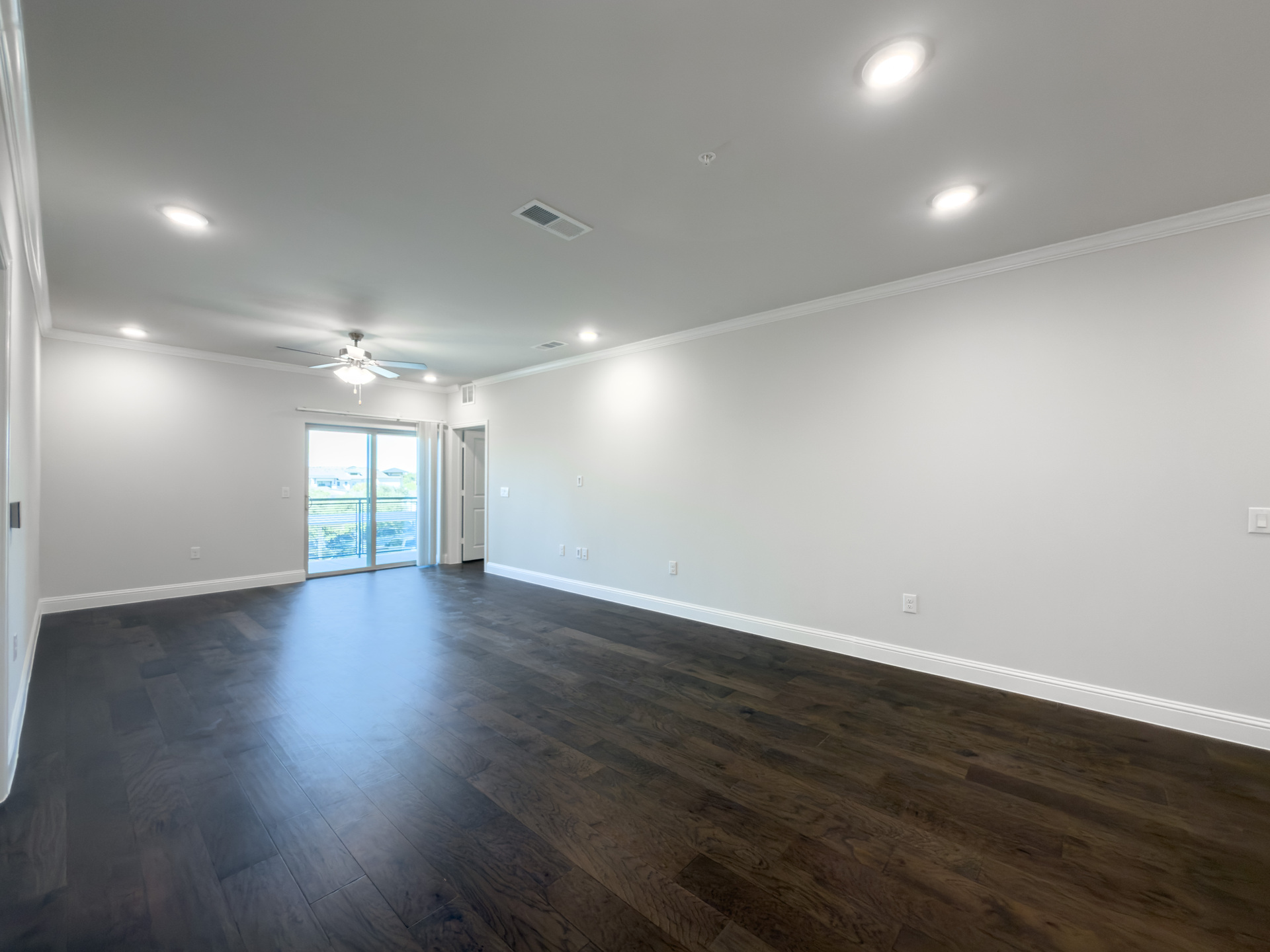 spacious great room with hardwood flooring