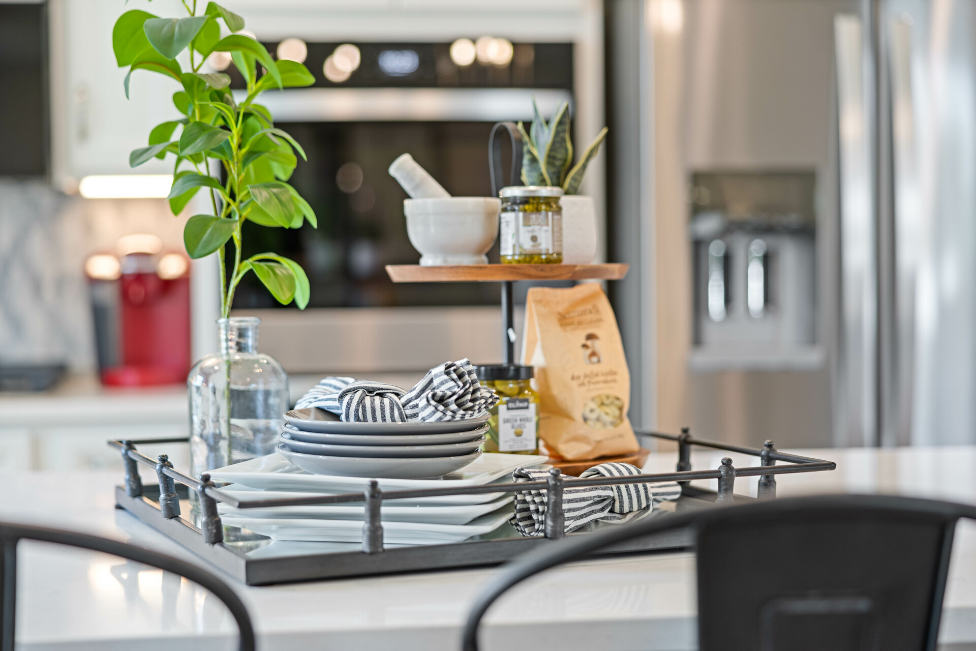 kitchen with white countertops, white cabinets, a large island, and stainless steel appliances