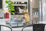 kitchen with white countertops, white cabinets, a large island, and stainless steel appliances
