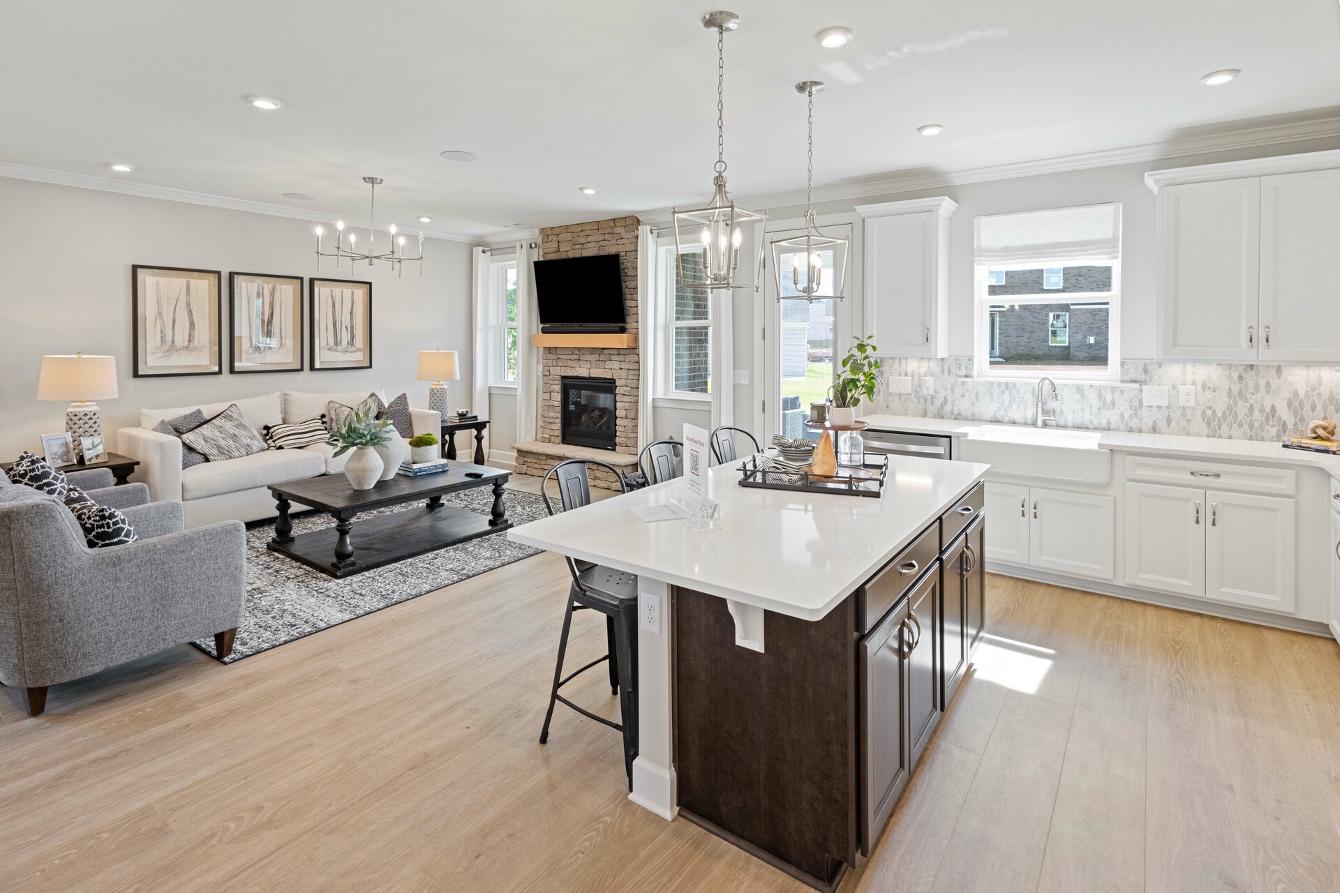 kitchen with white countertops, white cabinets, a large island, and stainless steel appliances