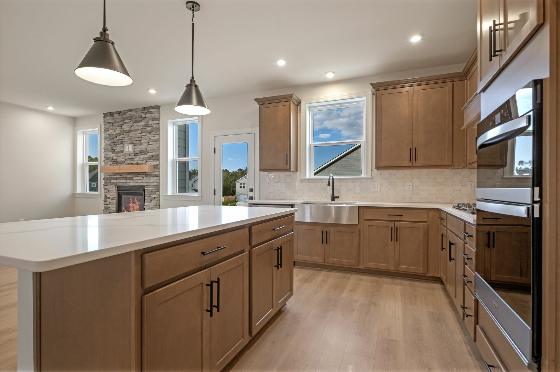 kitchen with wood cabinets, white countertops, and stainless steel appliances