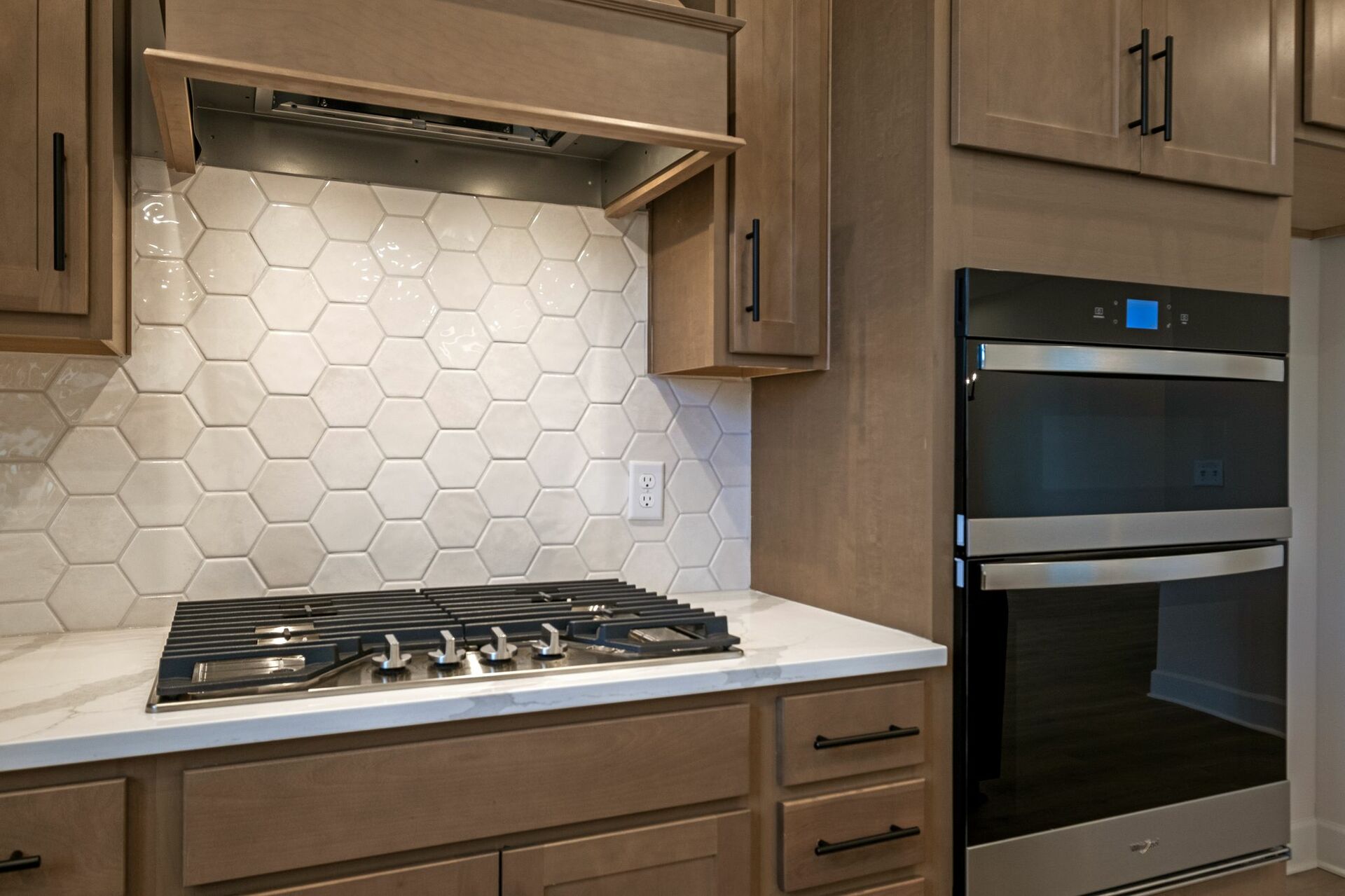 kitchen with wood cabinets, white countertops, and stainless steel appliances