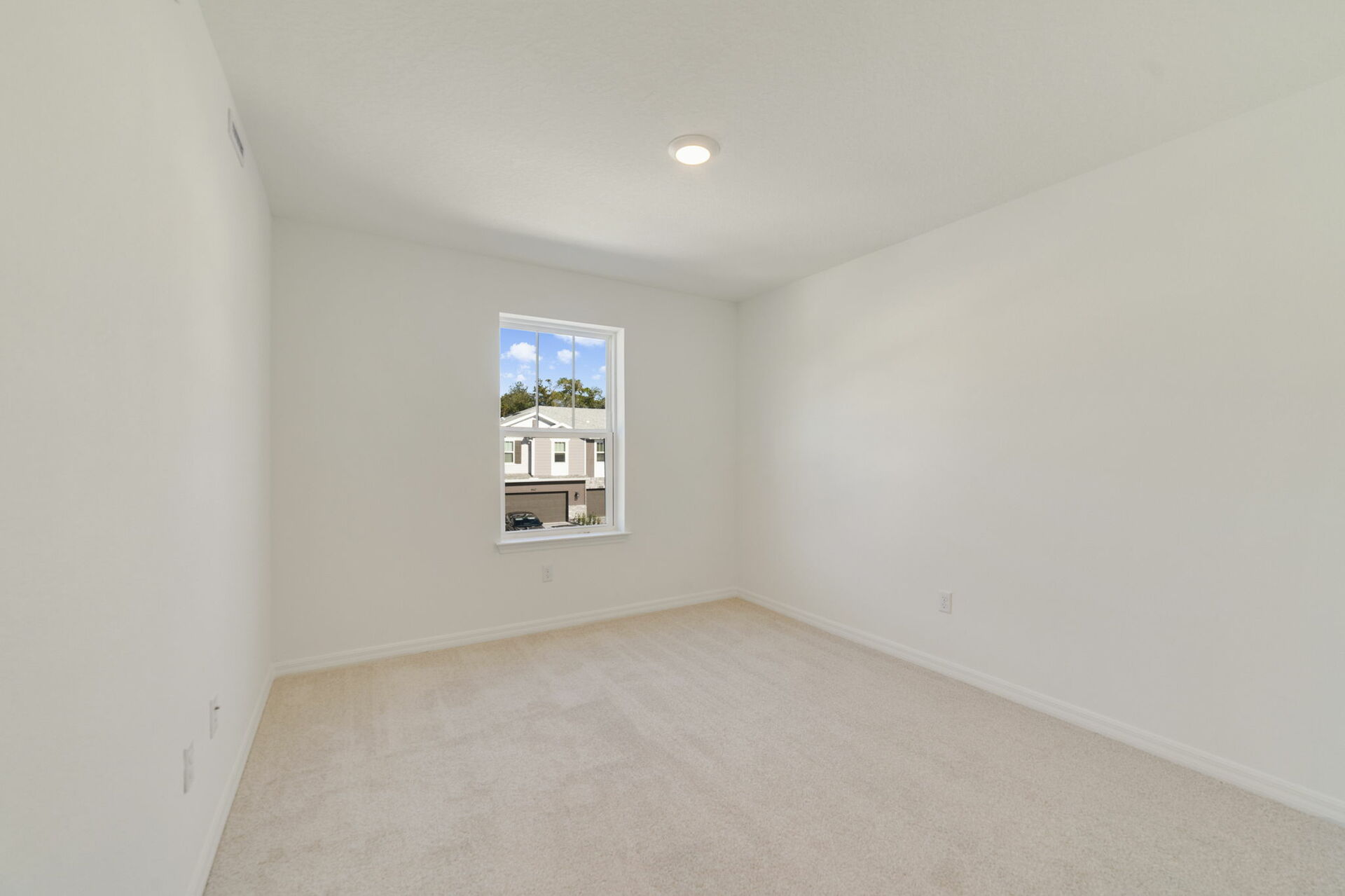 bedroom with single window, closet, and carpet throughout 