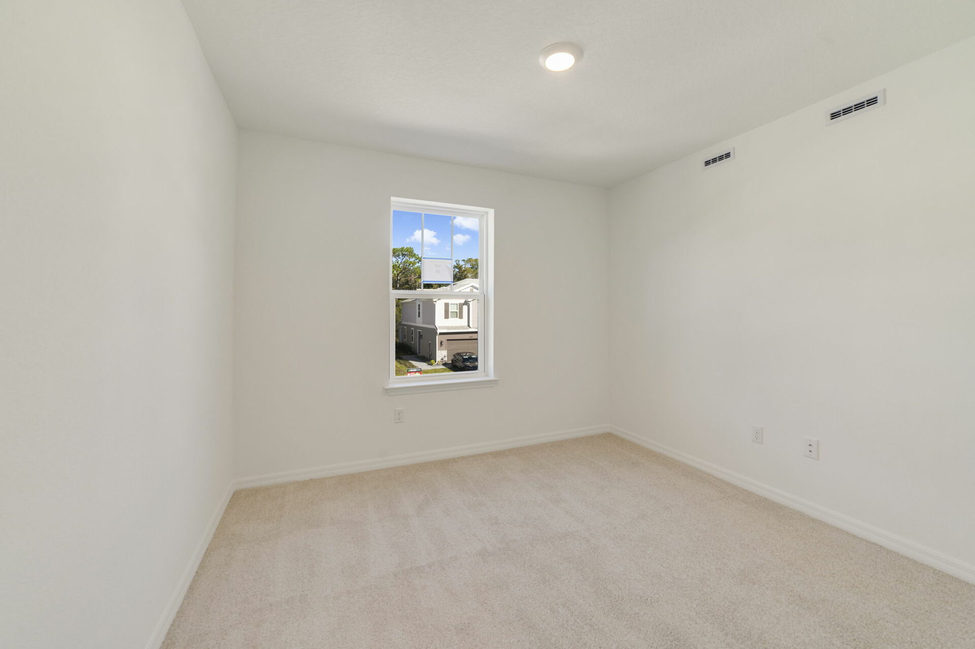 bedroom with single window, closet, and carpet throughout 