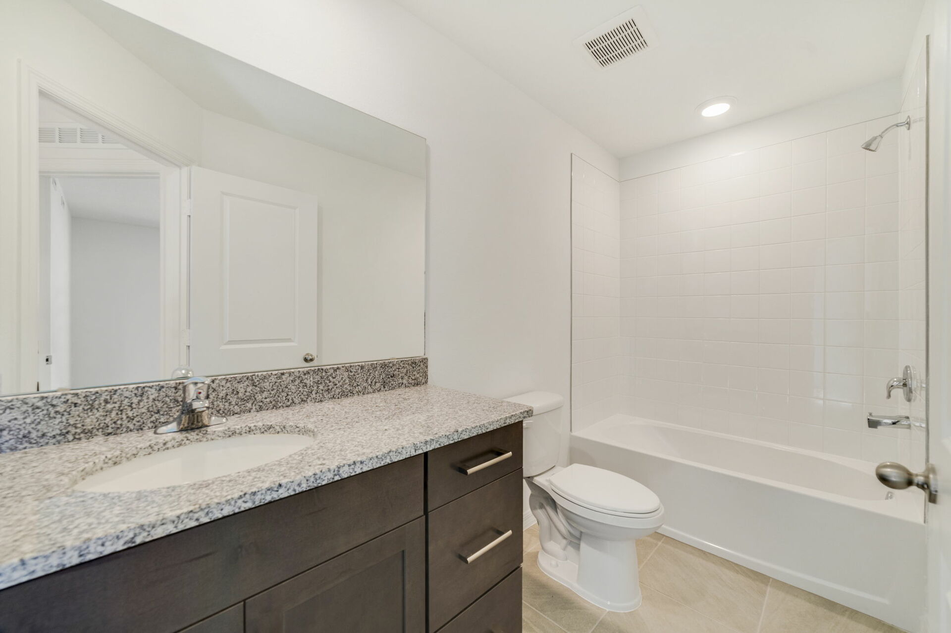 single sink vanity with water closet and shower