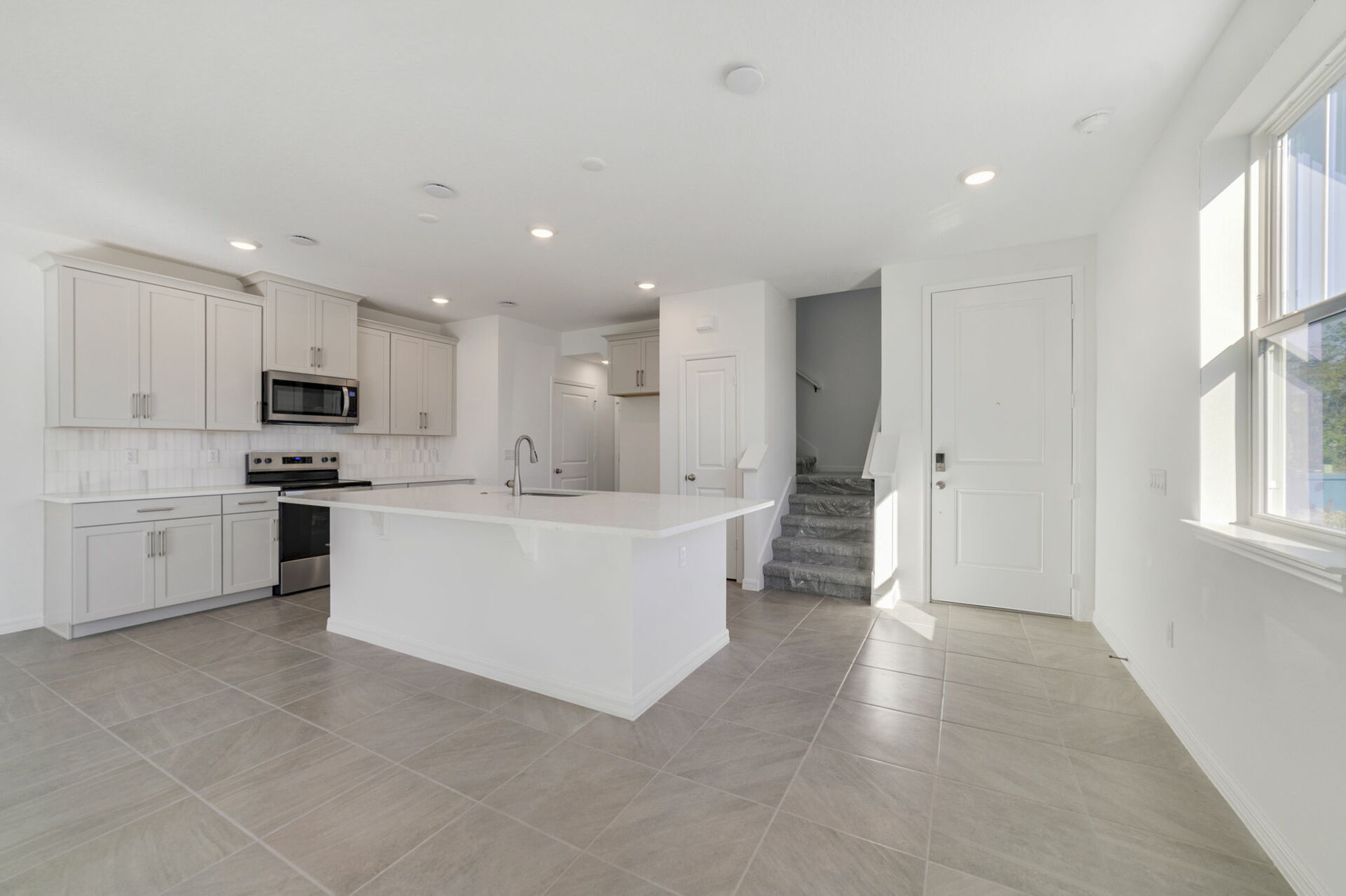 kitchen with view of island and pantry