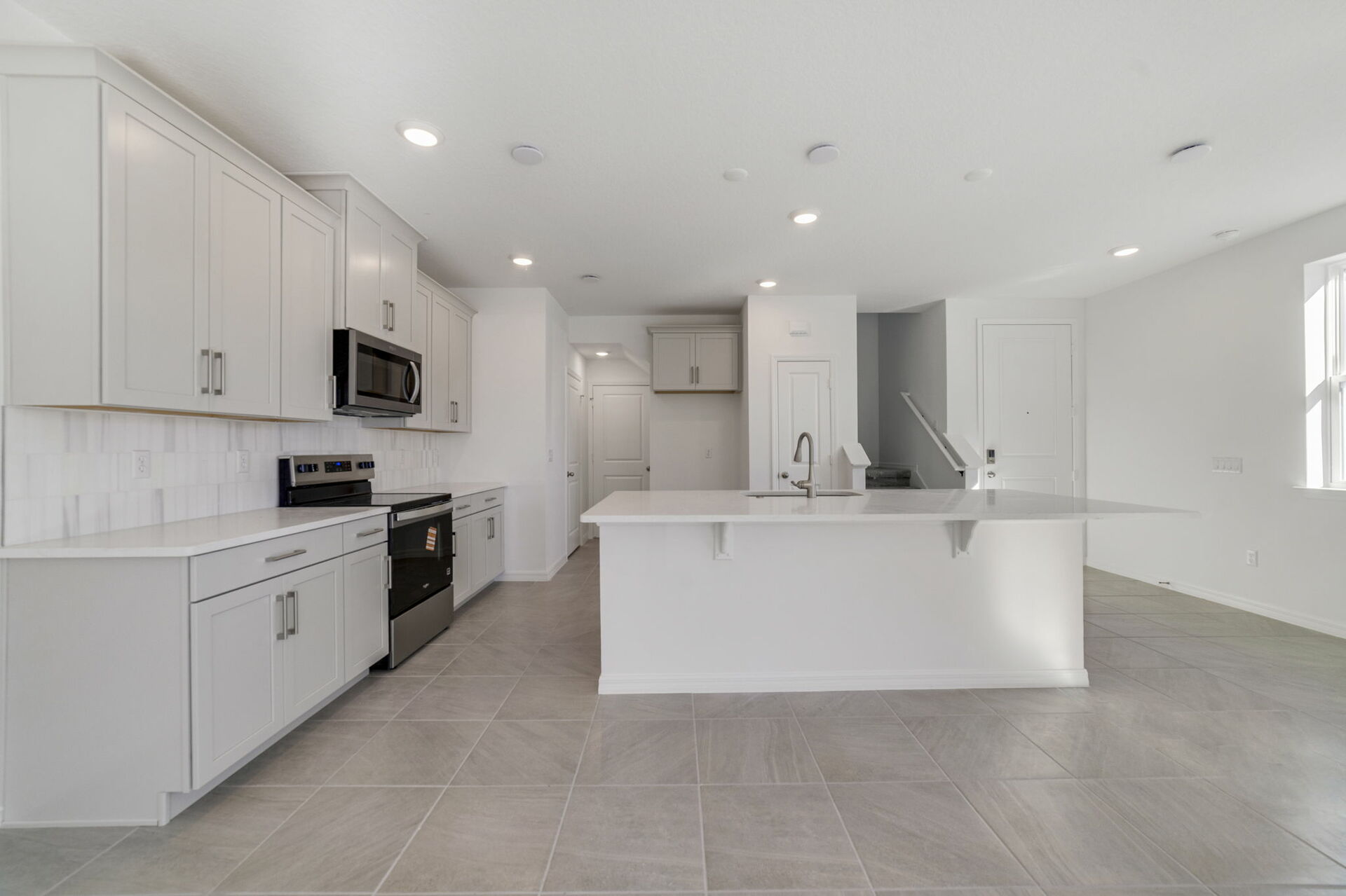 kitchen with view of island and pantry