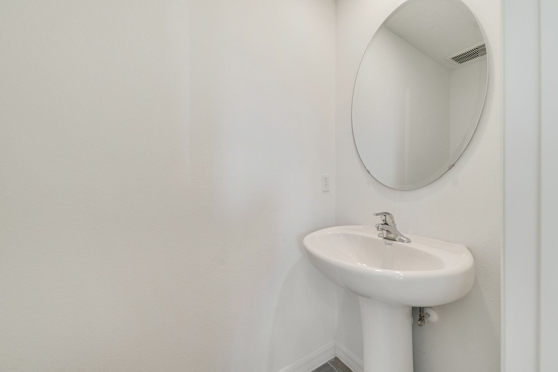 powder room with sink and mirror