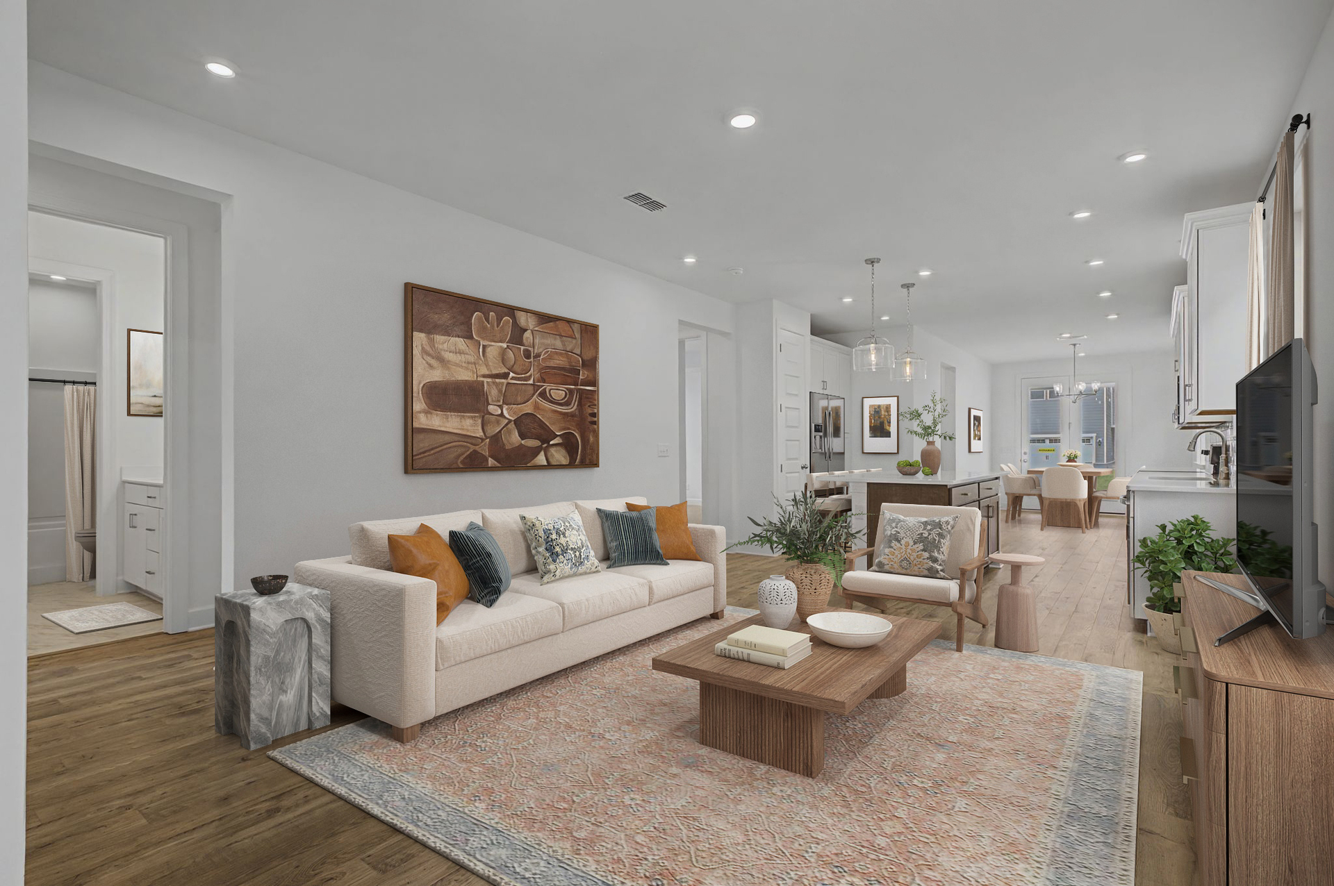 great room with wooden floors, large windows, an area rug, couch, wall art, wooden coffee table, and wooden tv stand
