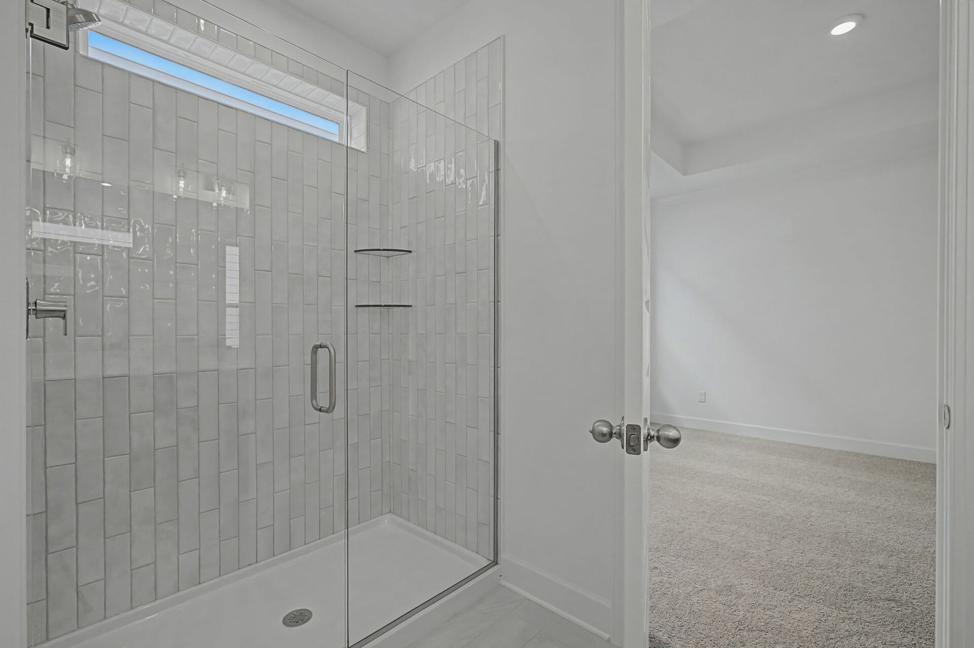 primary bathroom with walk-in glass shower