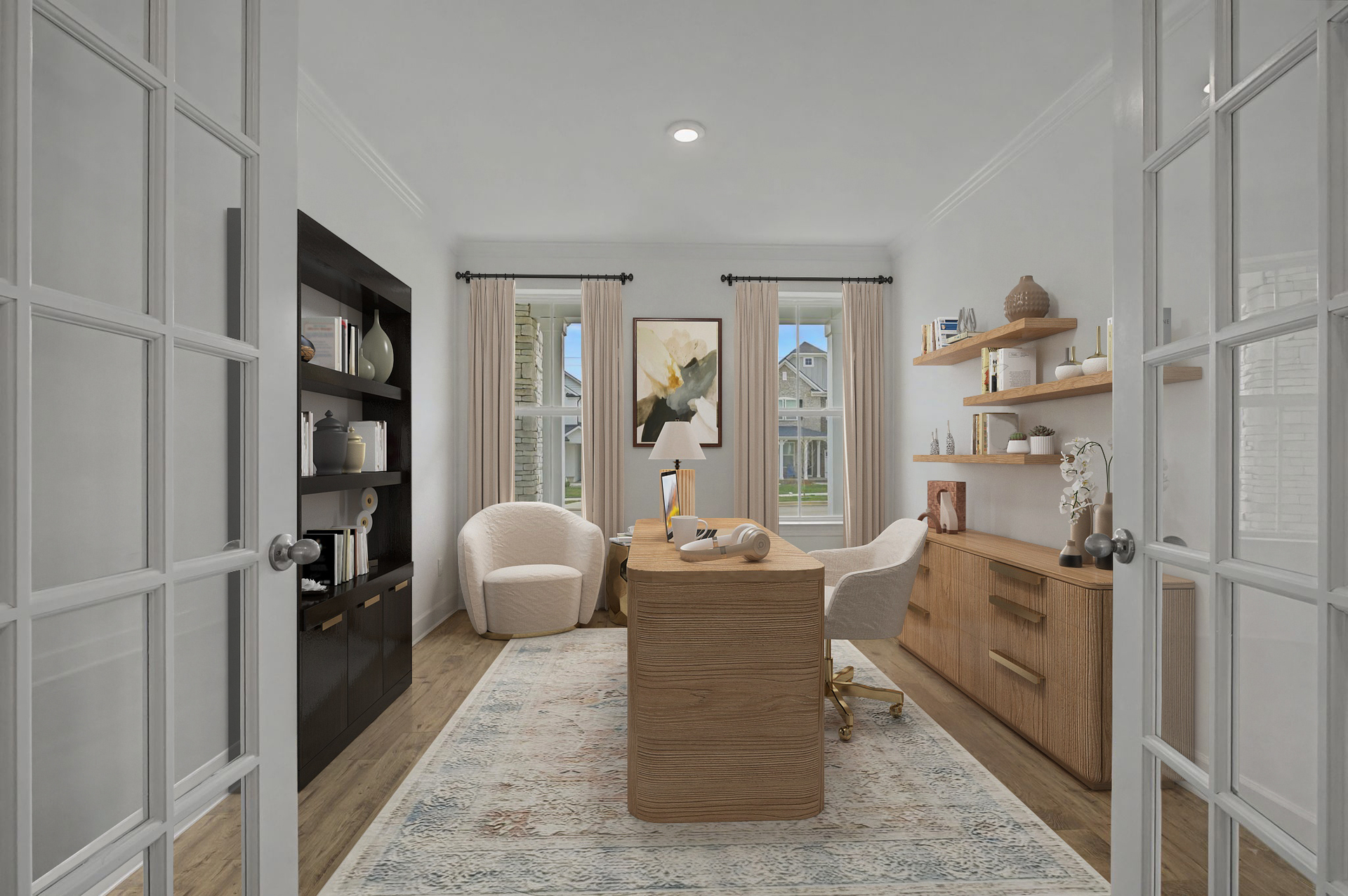 study with wood floors, large windows, an area rug, a wooden desk, wooden floating shelves, a black bookshelf, and accent chairs