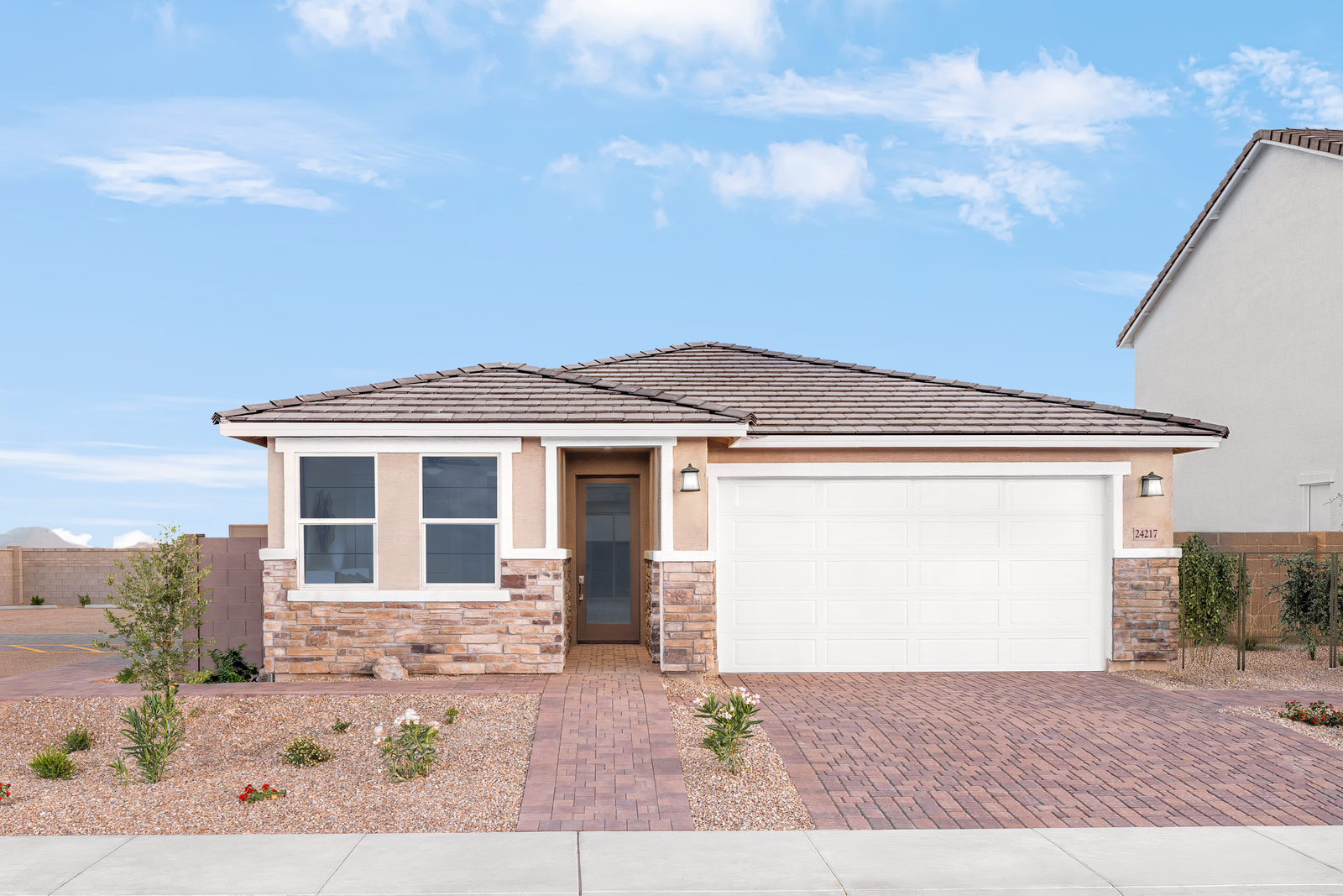 single-story home with desert landscaping 