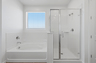 spacious bathroom with soaking tub and walk-in shower