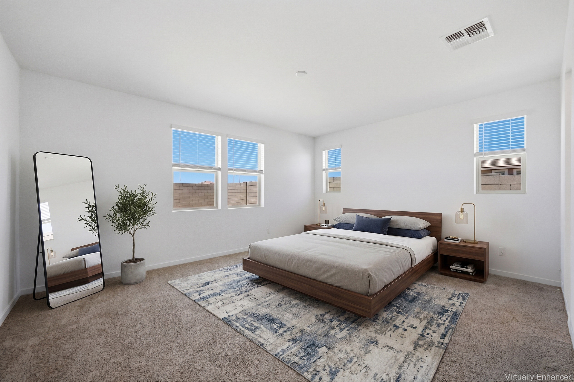 spacious bedroom with king-sized mattress, walnut bedframe, and walnut nightstands