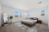 spacious bedroom with king-sized mattress, walnut bedframe, and walnut nightstands