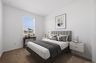 bedroom with a floating wood bedframe, full-sized mattress, and white floating nightstands