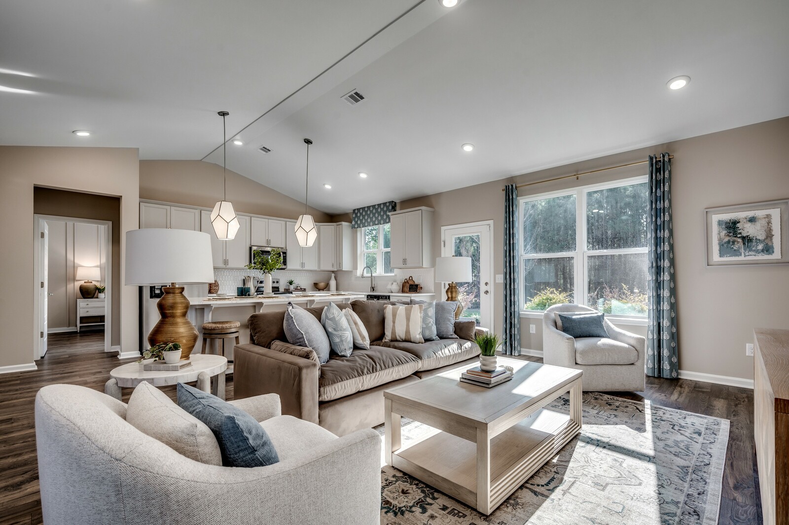 tan walls and large windows with natural lighting