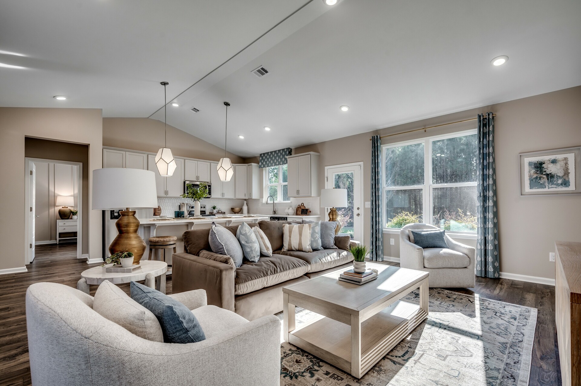 tan walls and large windows with natural lighting