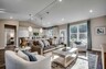 tan walls and large windows with natural lighting