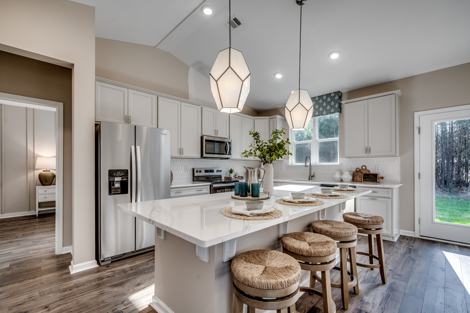 open-concept with white cabinets 