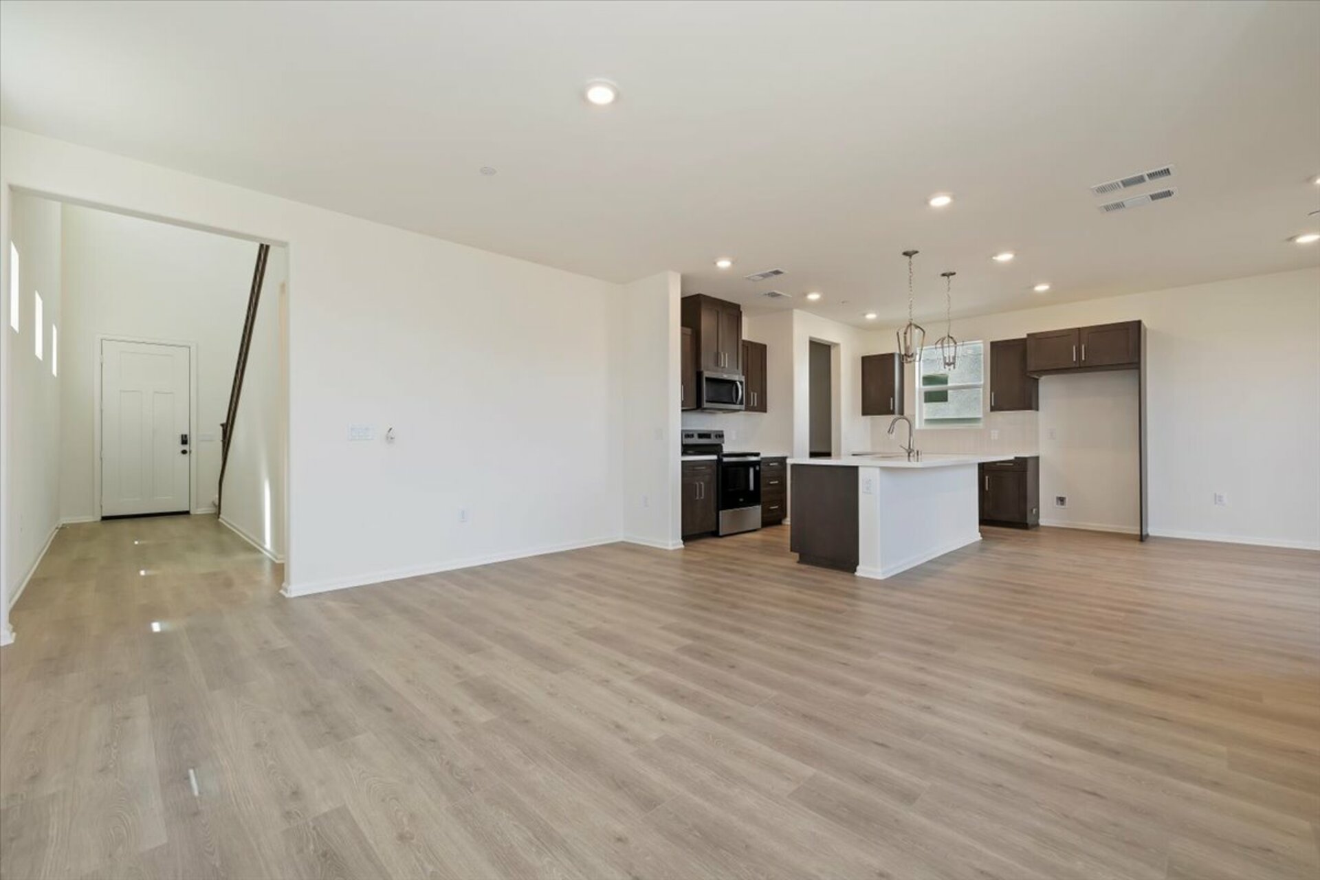 kitchen with dark brown cabinets and a large island
