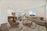 great room featuring a sectional and chair with a brown square coffee table