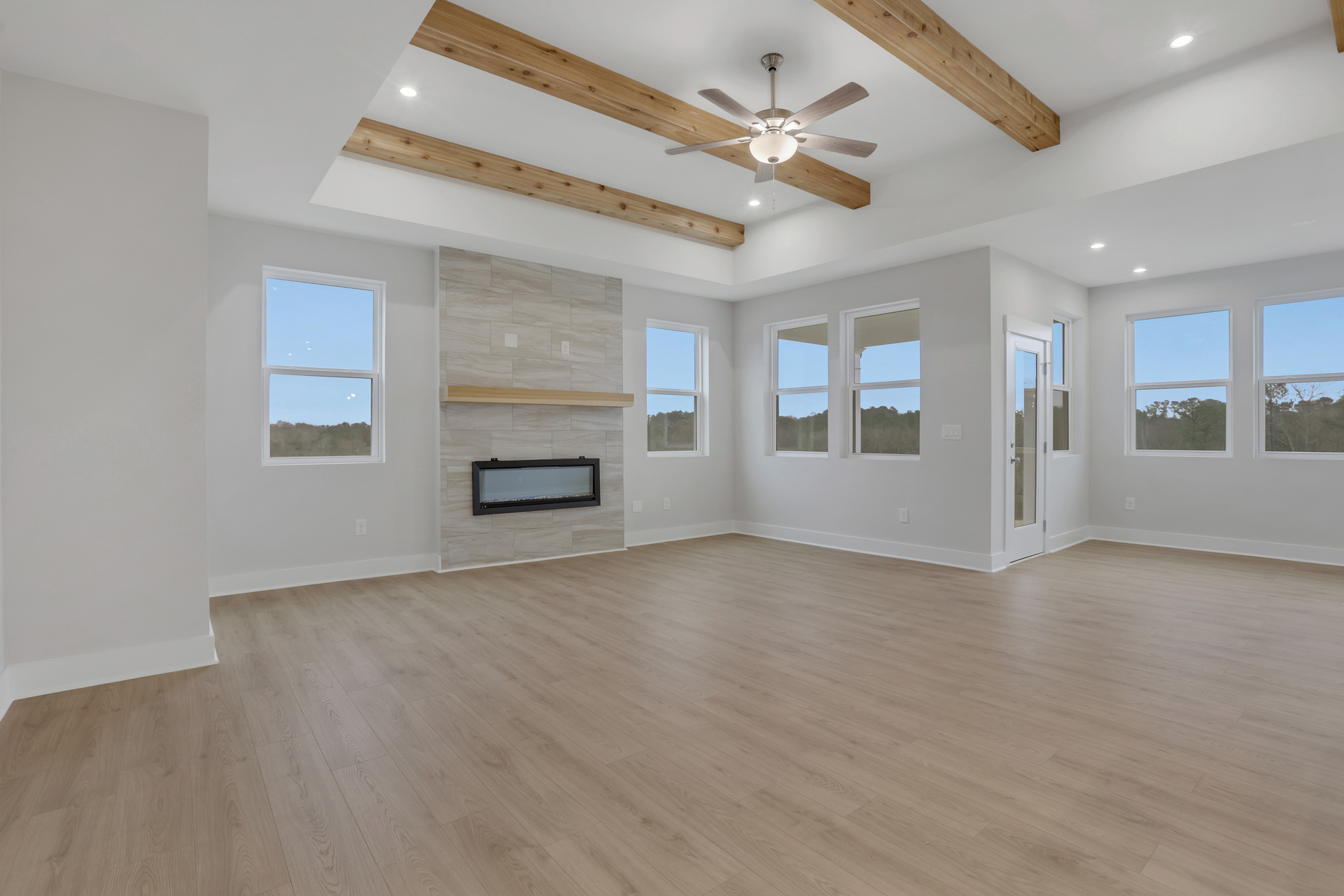 great room with hard-surface flooring and wood beams