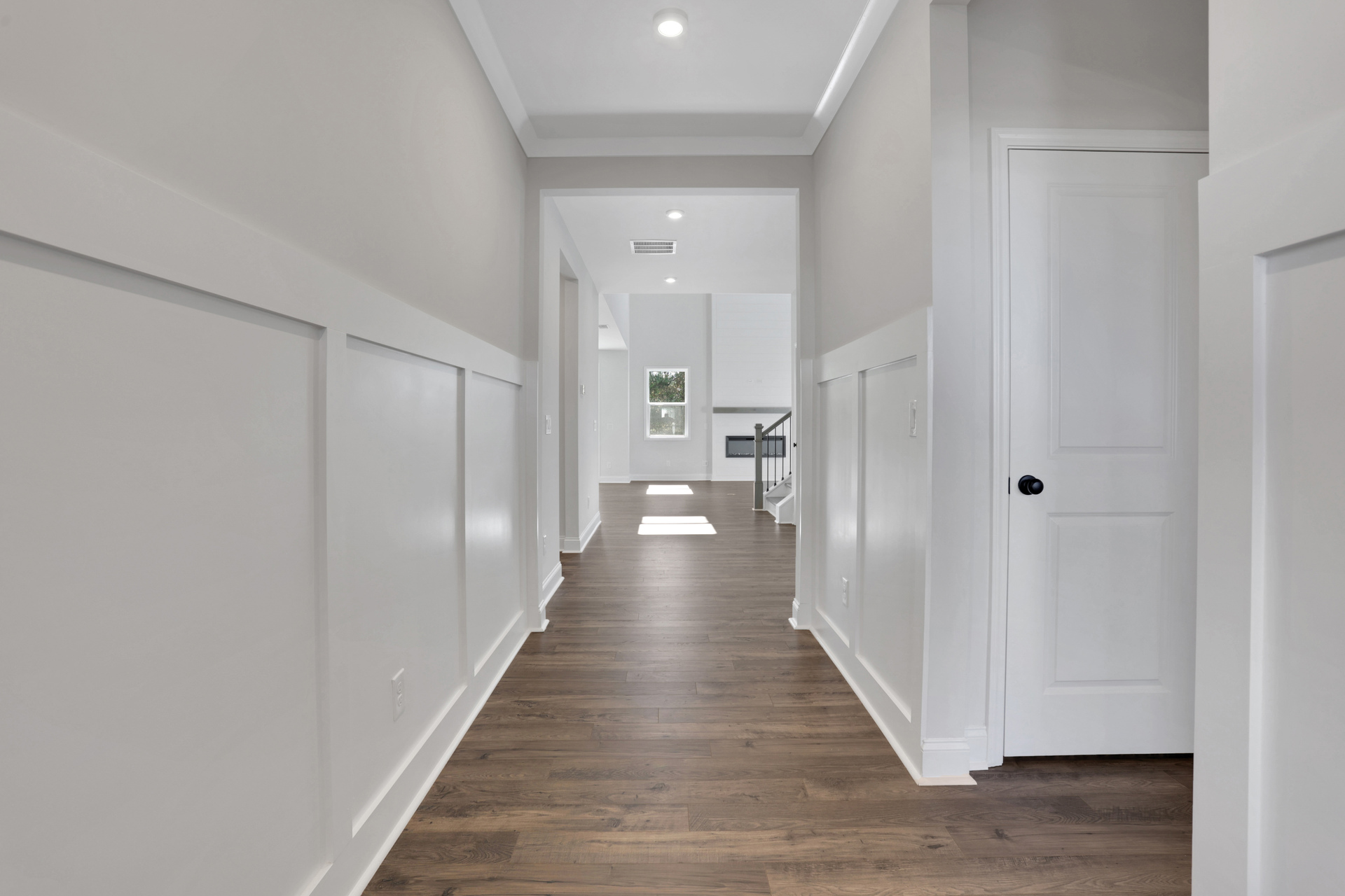 entryway with hard-surface flooring and wainscoting on the walls