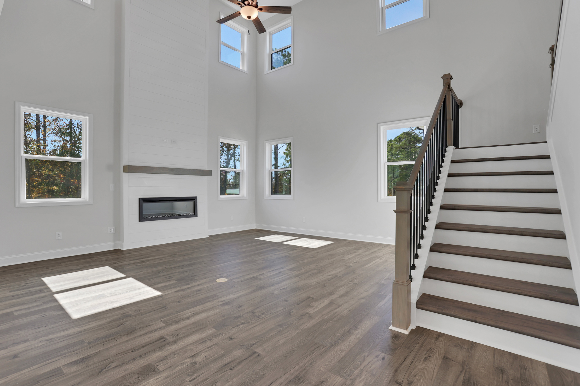 2-story great room with floor-to-ceiling fireplace and hard-surface flooring