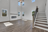 2-story great room with floor-to-ceiling fireplace and hard-surface flooring