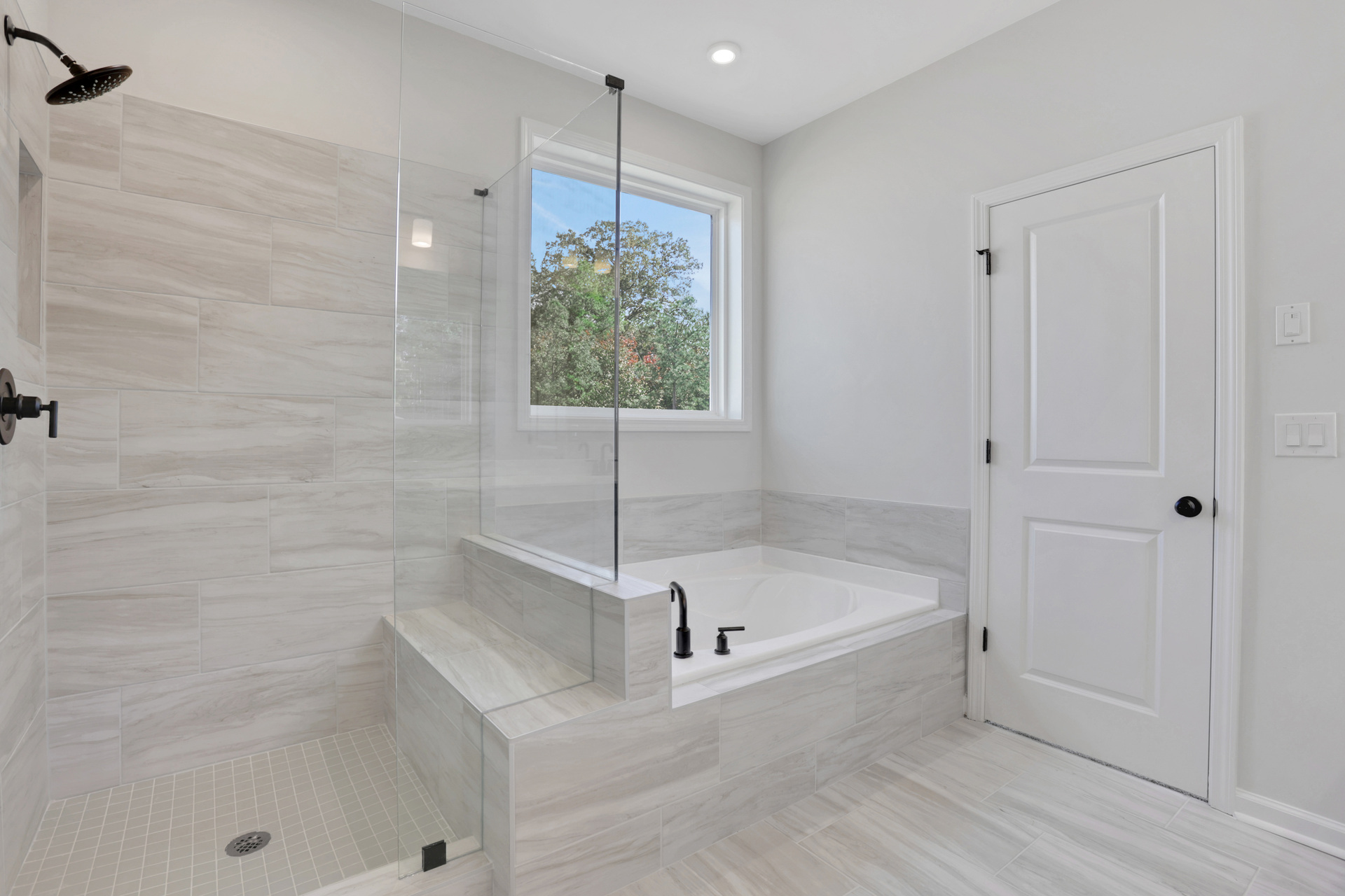primary bathroom with separate shower and tub