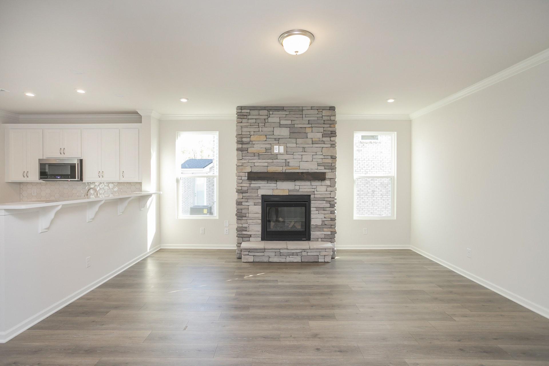great room with stone fireplace