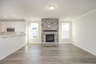 great room with stone fireplace