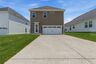 home exterior with back patio and two car garage